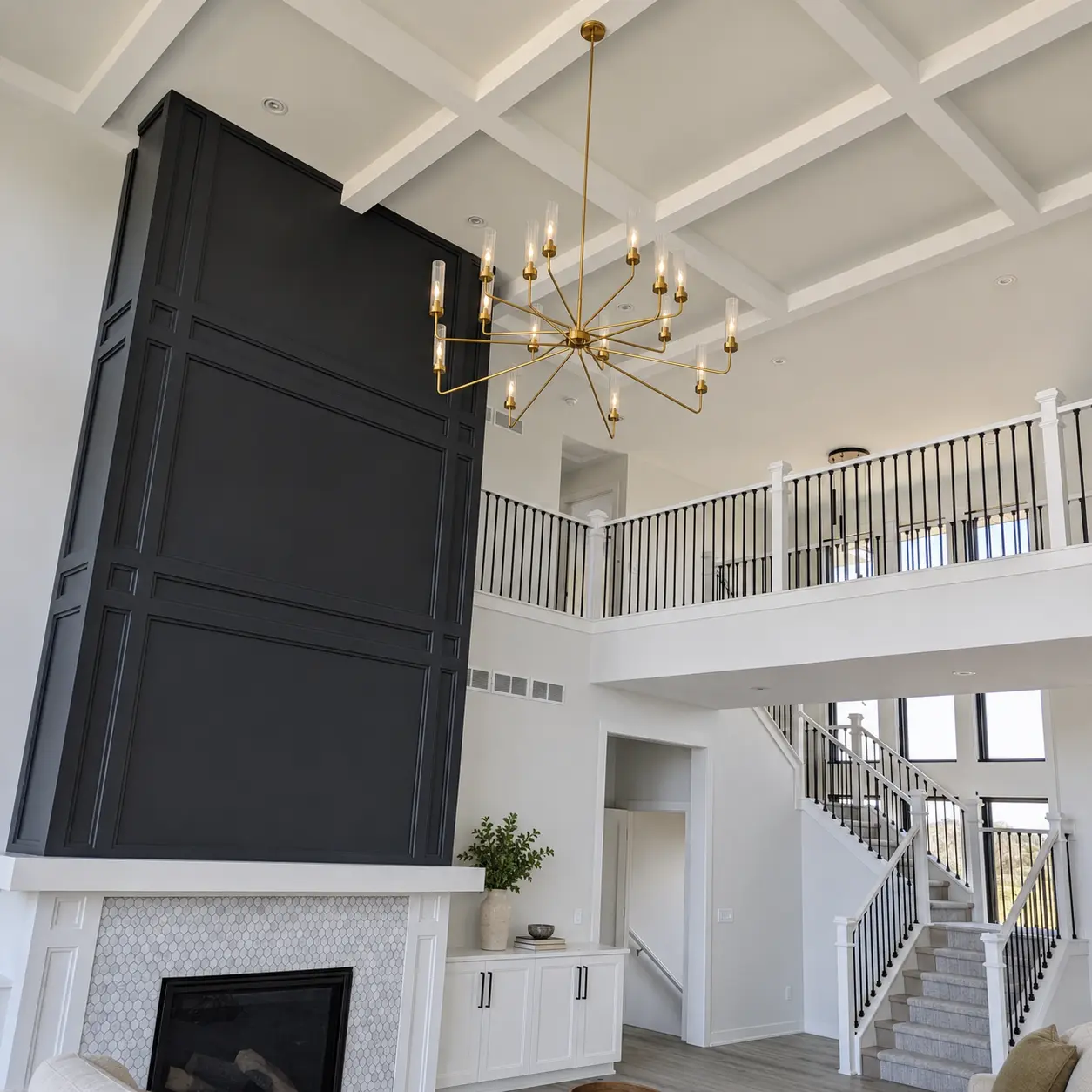Finished interior millwork, coffered ceiling, and stair presentation based on Signature Finish Carpentry project work